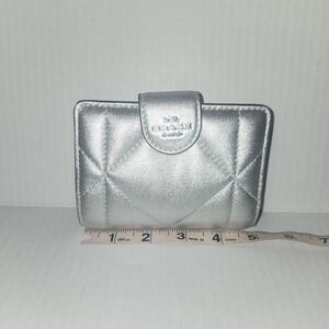 Coach Medium Corner Zip Wallet With Puffy Diamond Quilting in Metallic Silver.